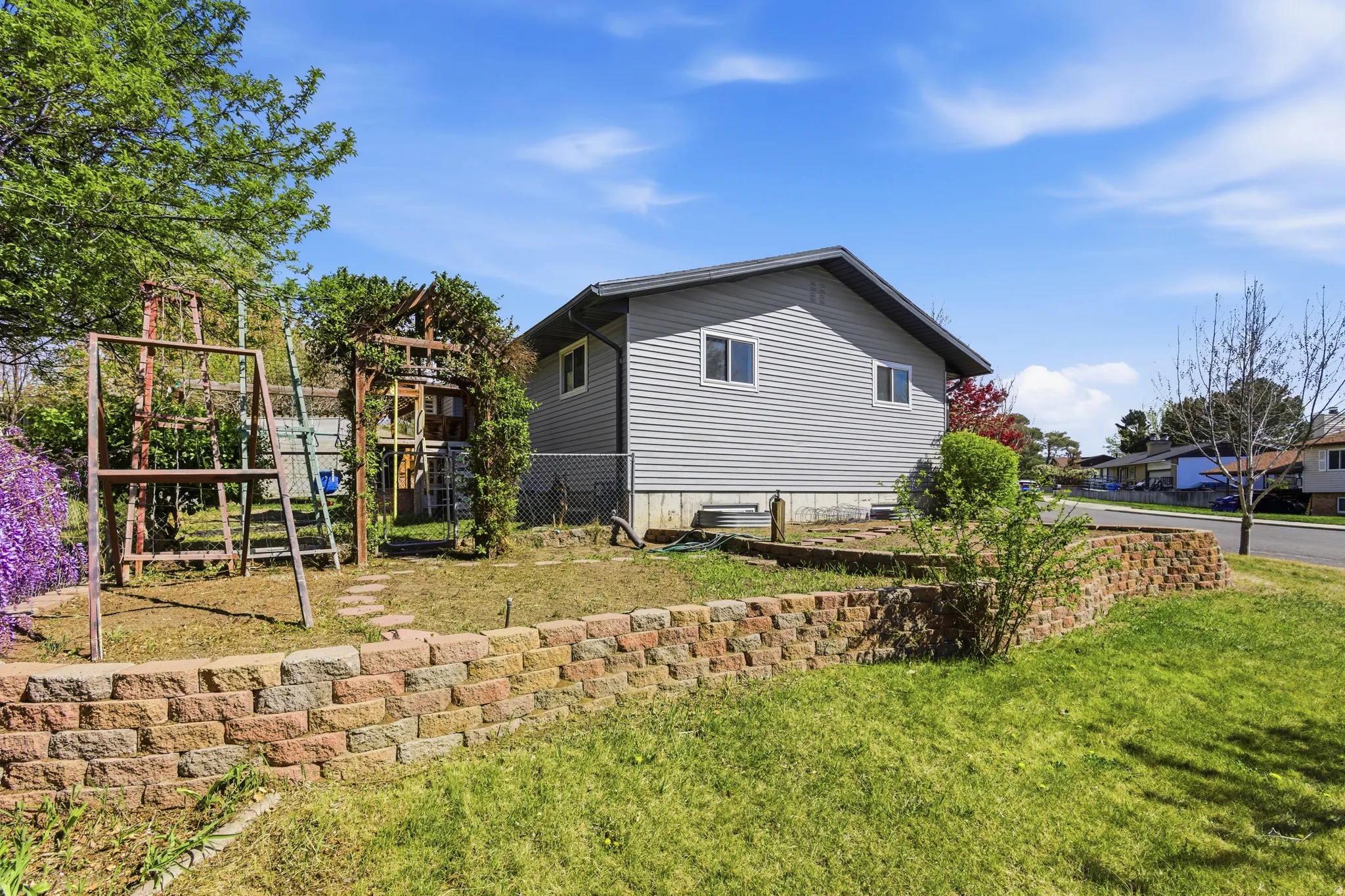 View of side of property with a playground