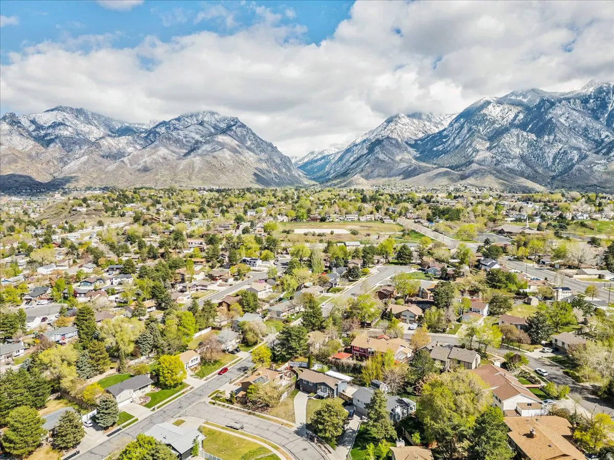 Aerial view of residential area featuring mountains