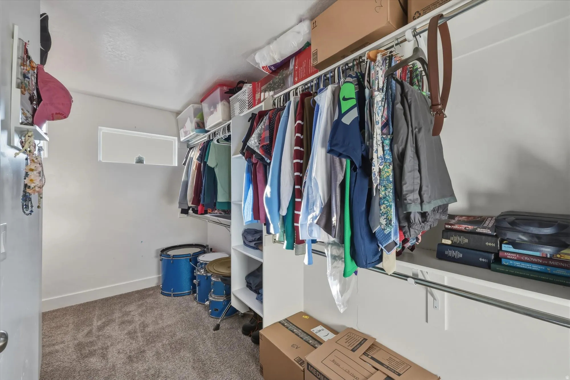 Walk in closet featuring carpet flooring