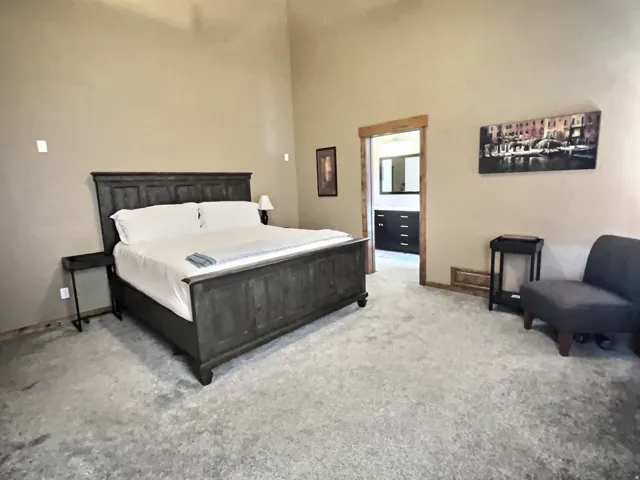 Main level master bedroom with ensuite bathroom, walk-in closet and laundry
