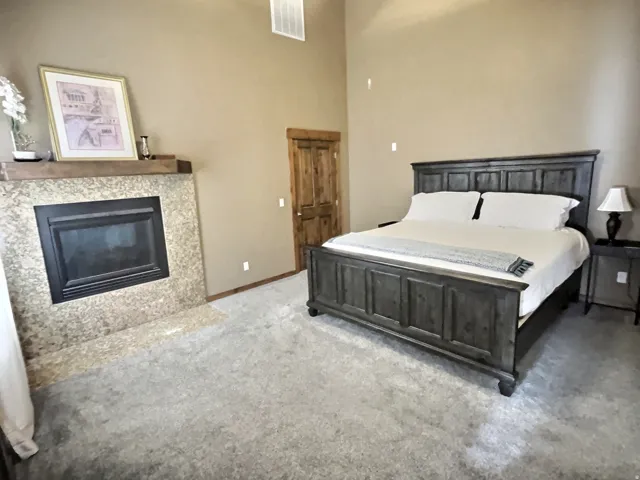 Main level master bedroom with ensuite bathroom, walk-in closet and laundry