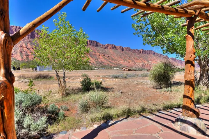 View of patio with a mountain view and a pergola