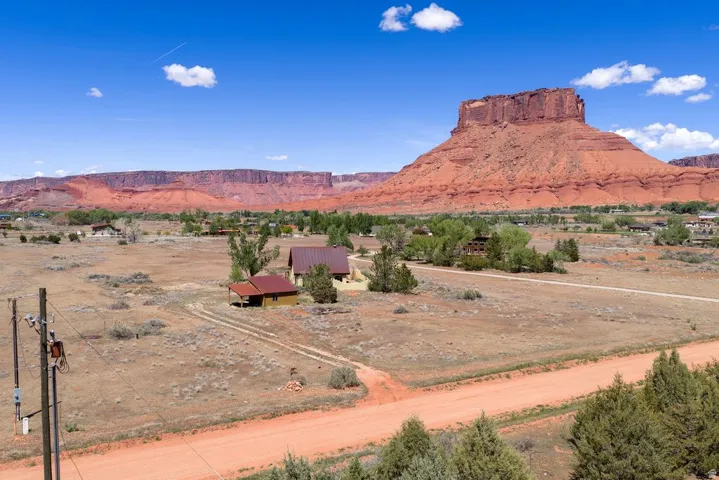 View of mountain backdrop with rural landscape