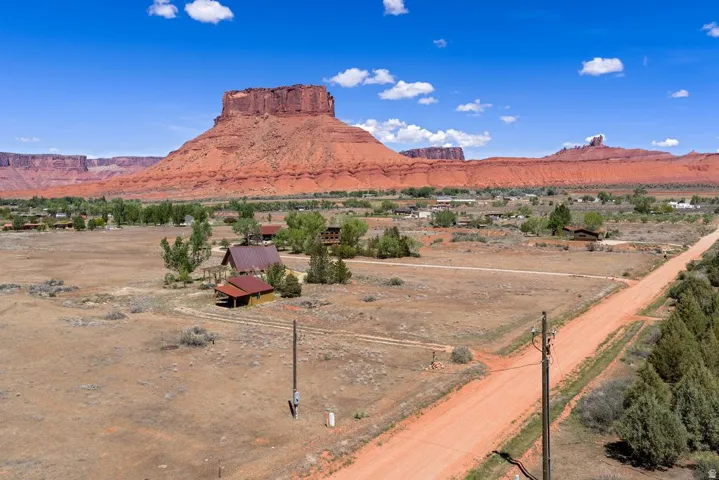 View of mountain backdrop with rural landscape