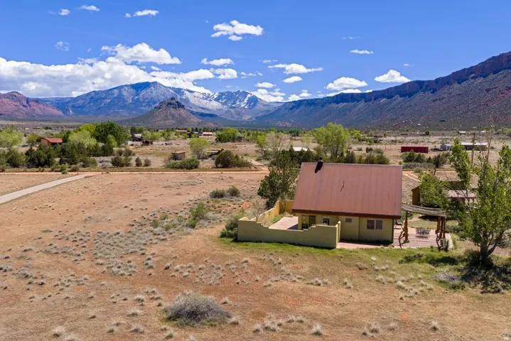 View of mountain backdrop featuring rural landscape