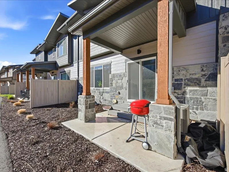 View of patio with partitions that backs to open space and hike/bike trail