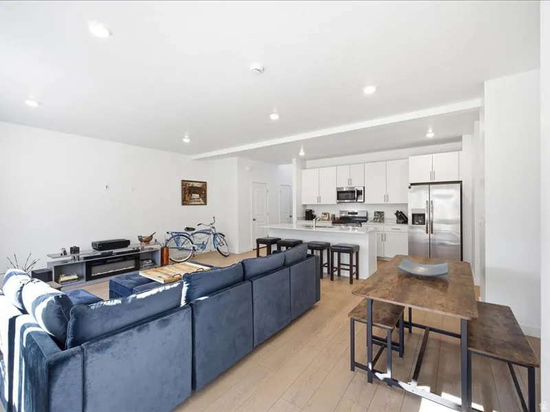 Living room featuring LVP flooring, open floor plan and tons of natural light.