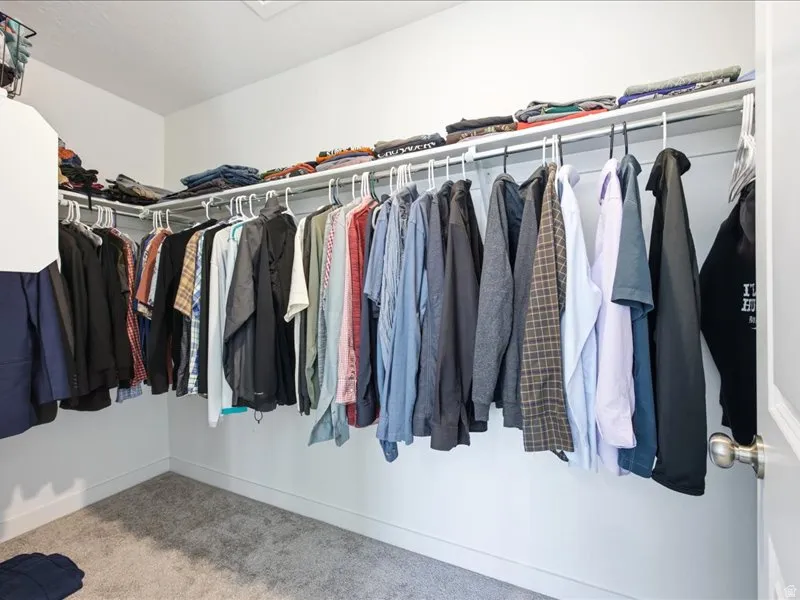 Large primary bedroom with en-suite bath and large walk-in closet