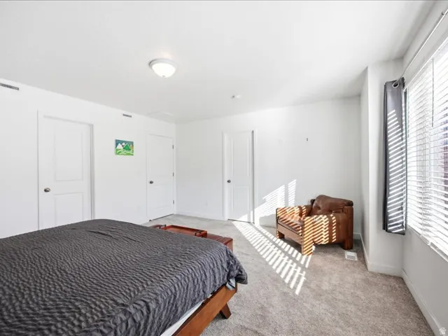 Large primary bedroom with en-suite bath and large walk-in closet