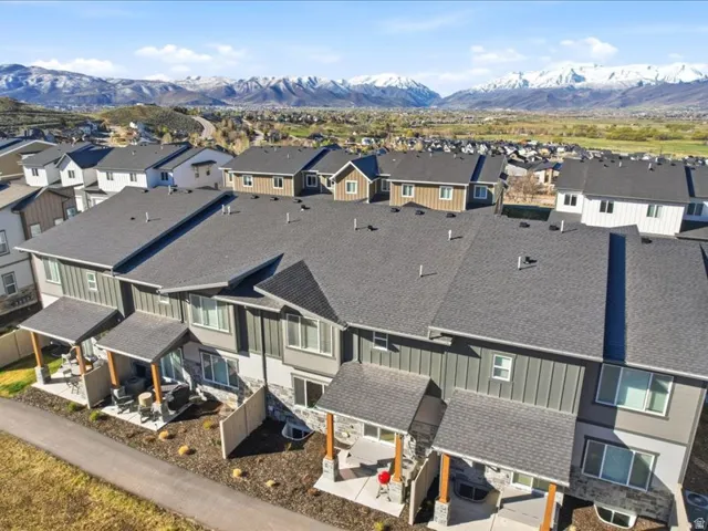 Aerial view of residential area featuring a mountainous background