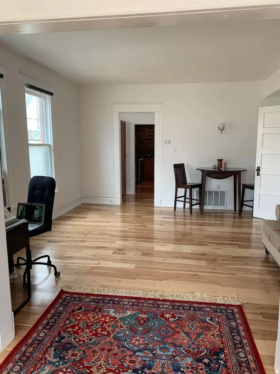 Home office featuring light wood-style floors and baseboards