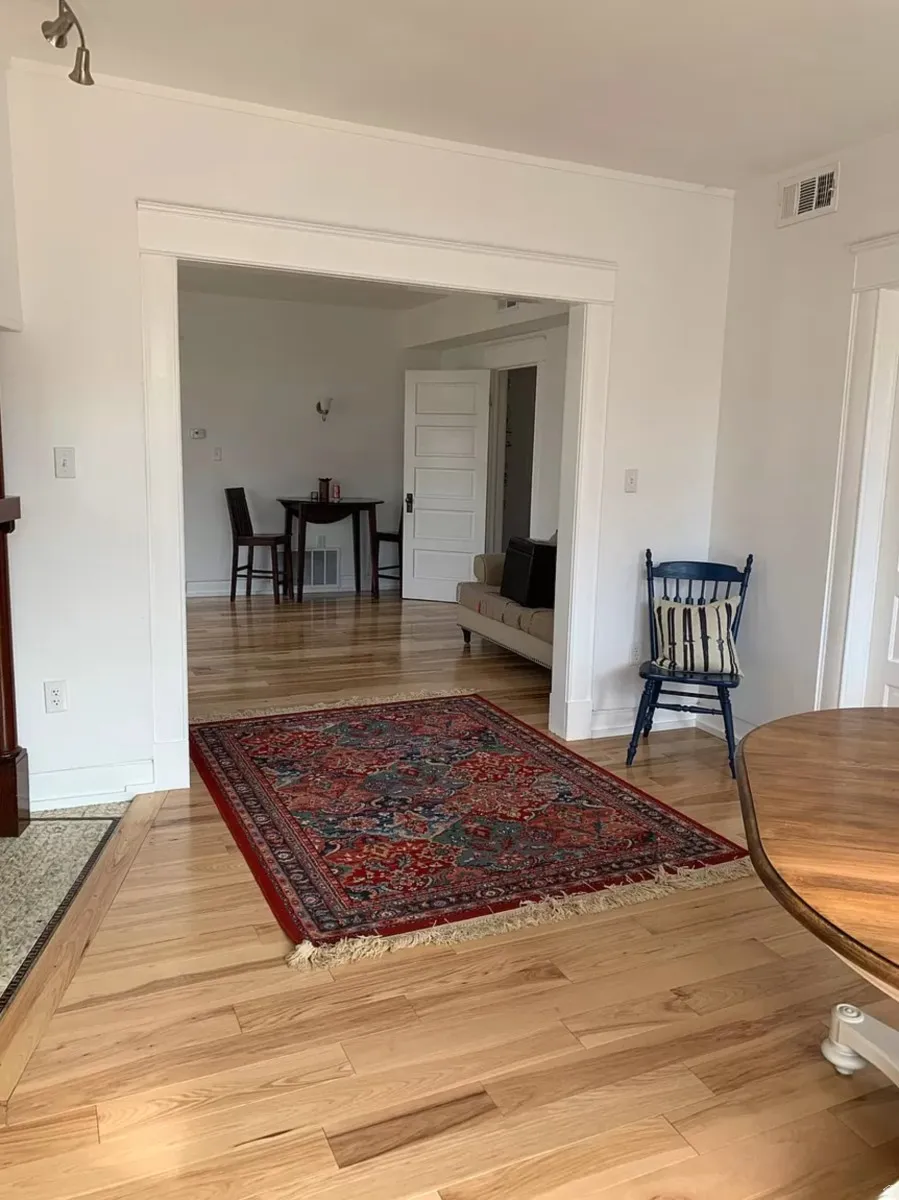 Living area featuring light wood finished floors and baseboards