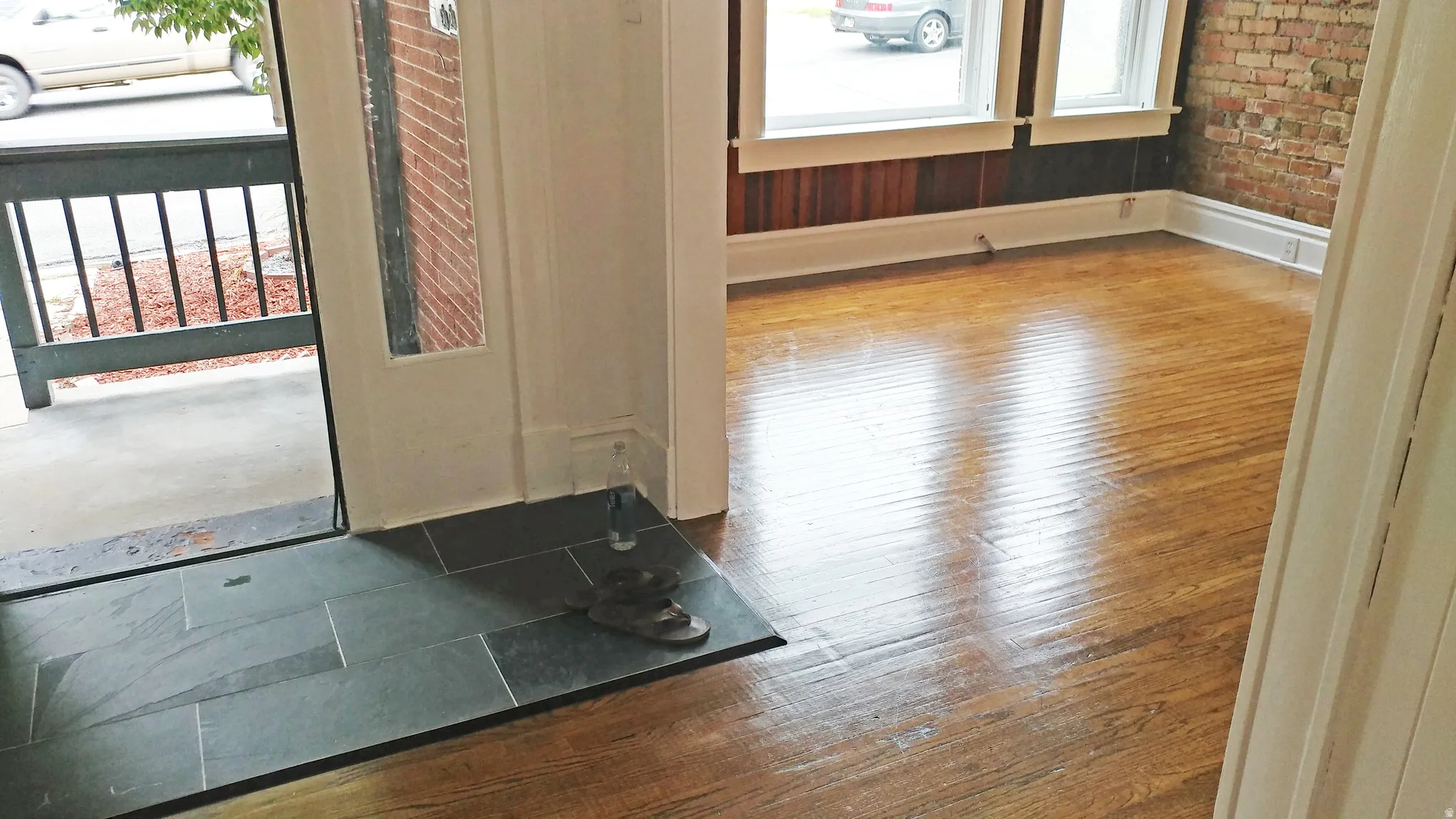 Hallway with hardwood / wood-style floors and baseboards