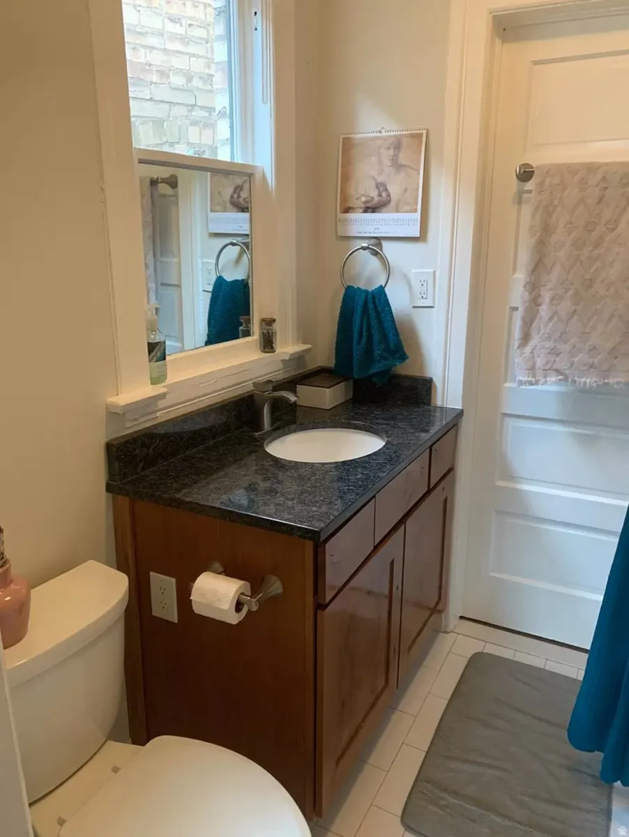 Bathroom featuring vanity and light tile patterned floors