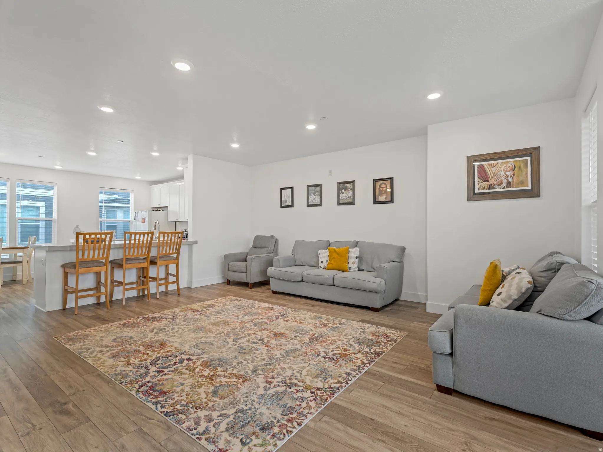 Living area featuring light wood-type flooring and recessed lighting