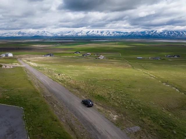 Aerial view of sparsely populated area with a mountainous background