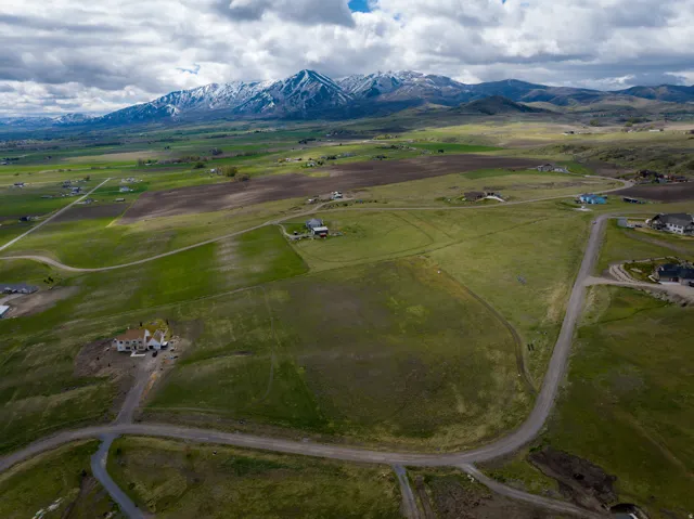 Aerial view of sparsely populated area with a mountainous background