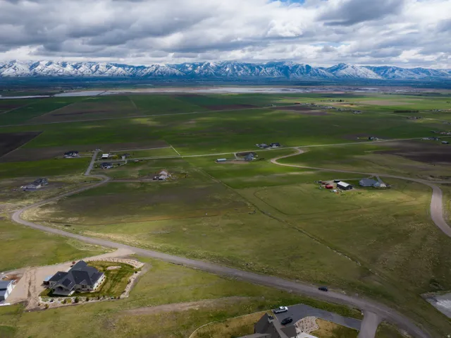 Aerial view of sparsely populated area with a mountain backdrop