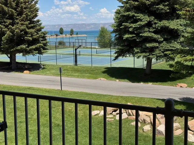 View of tennis court featuring a mountain view