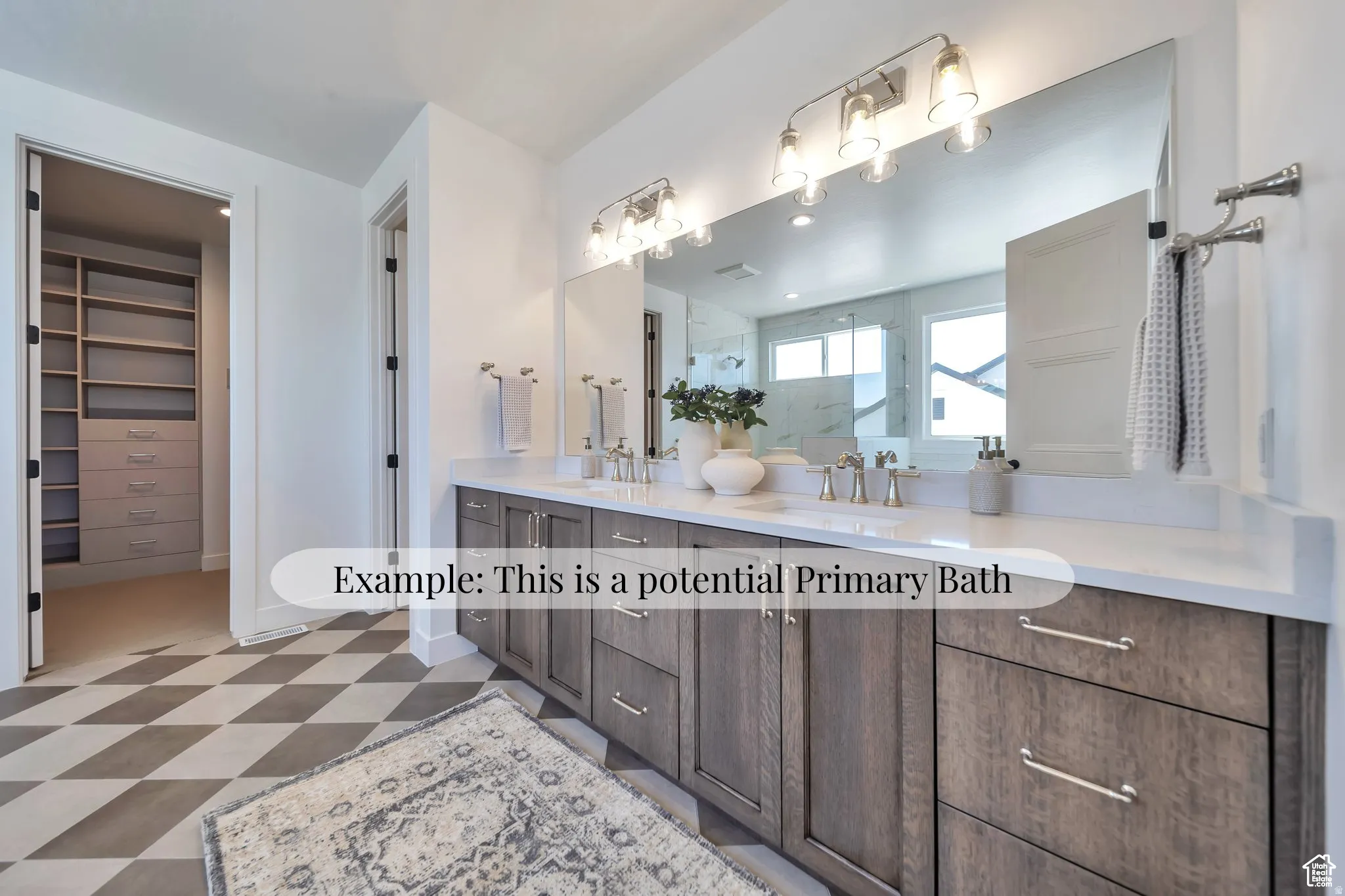 Bathroom with light floors, double vanity, a marble finish shower, and a spacious closet