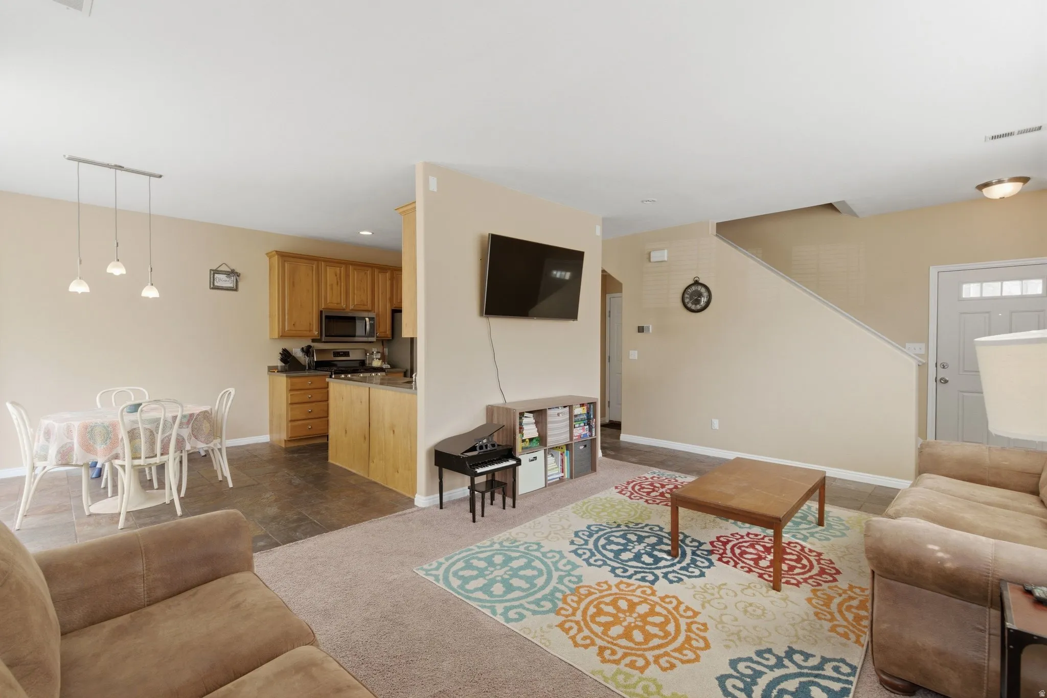 Living room with dark carpet and recessed lighting