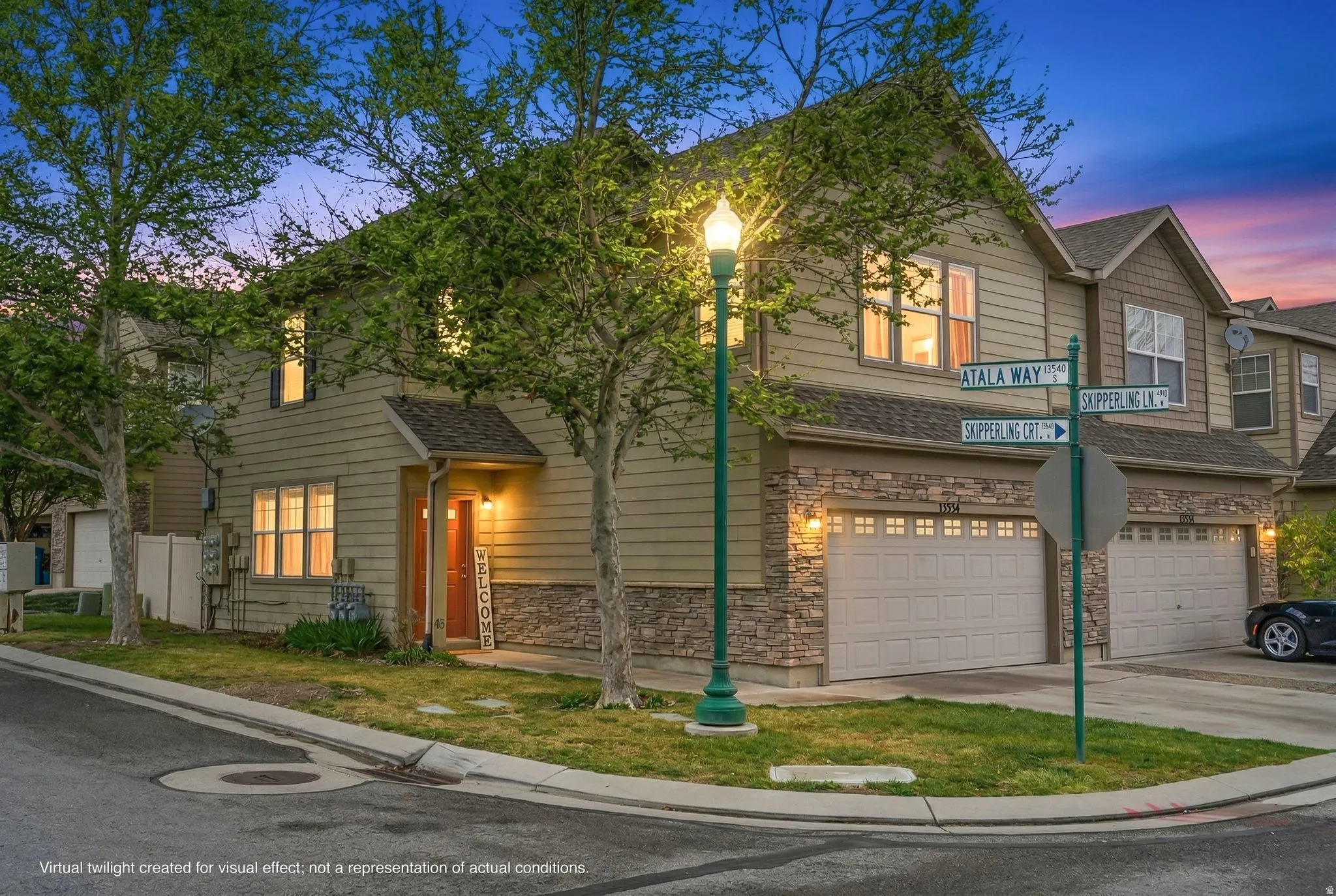 Traditional-style home featuring stone siding, a garage, concrete driveway, and a shingled roof
