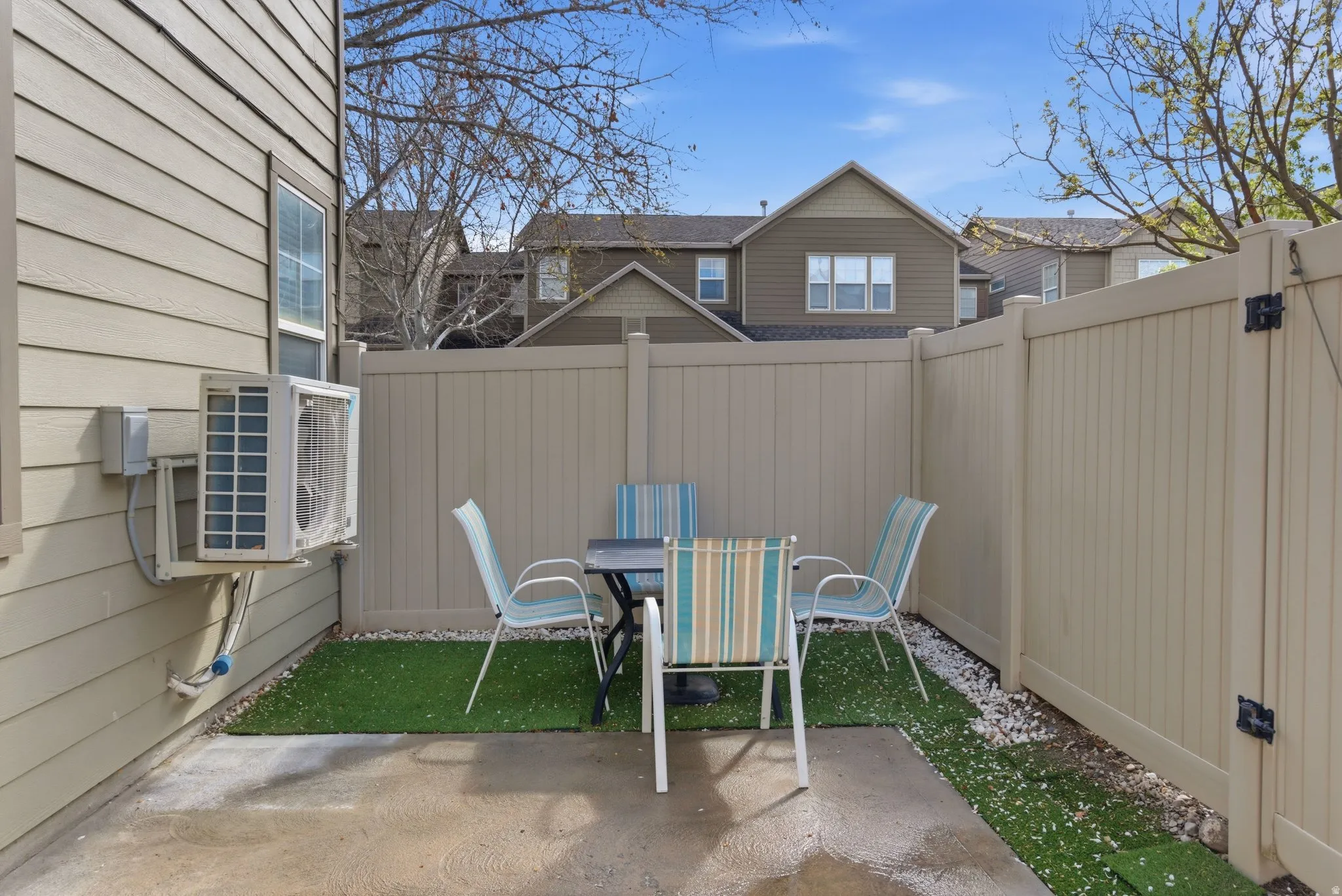 Fenced backyard with a patio and outdoor dining space