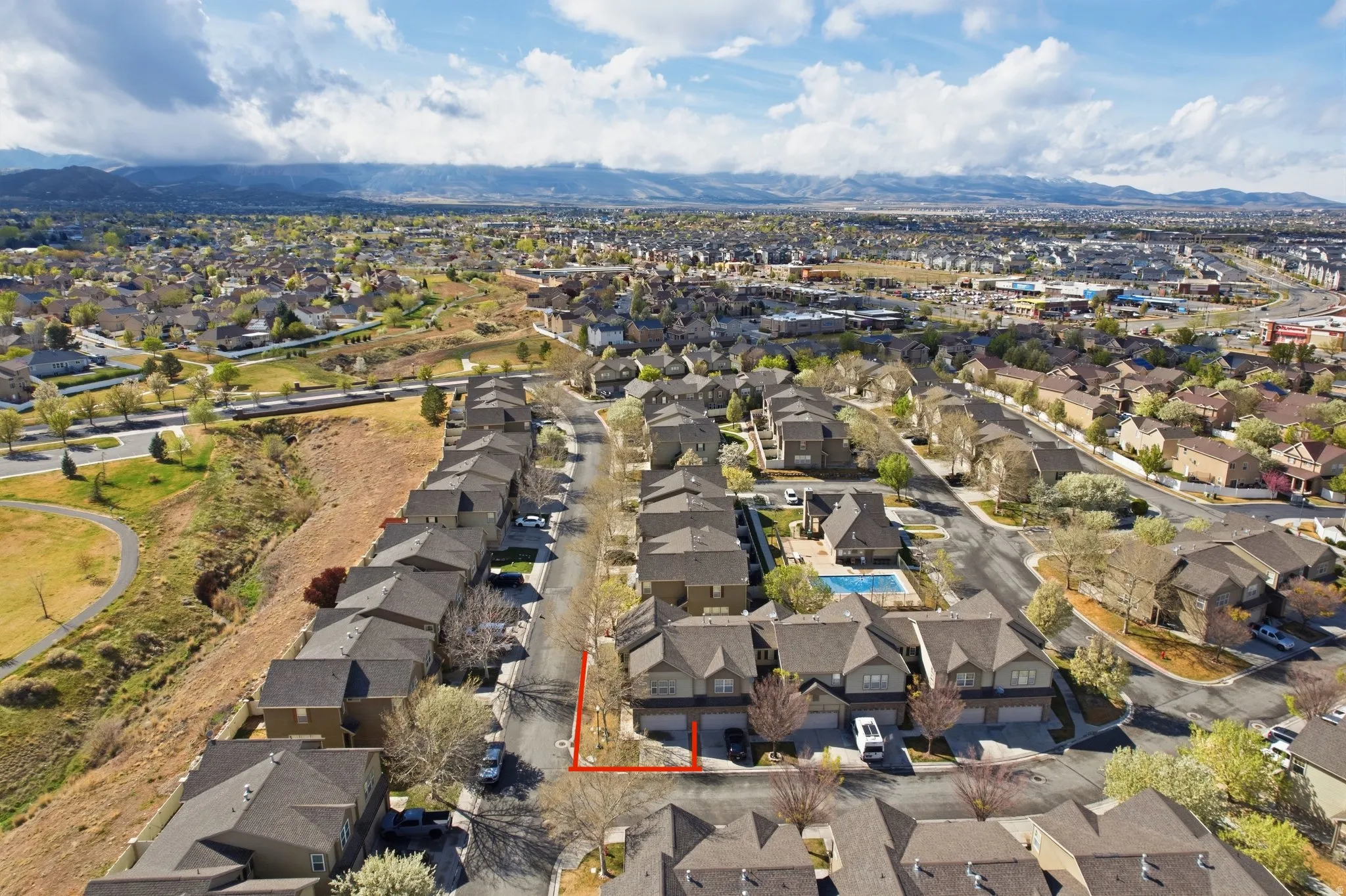 Aerial perspective of suburban area featuring mountains