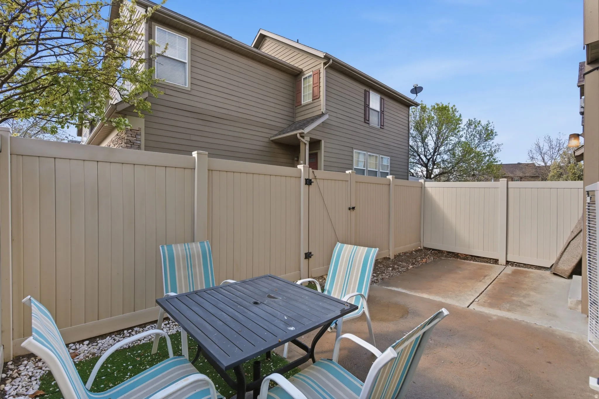 Fenced backyard featuring outdoor dining area and a patio area