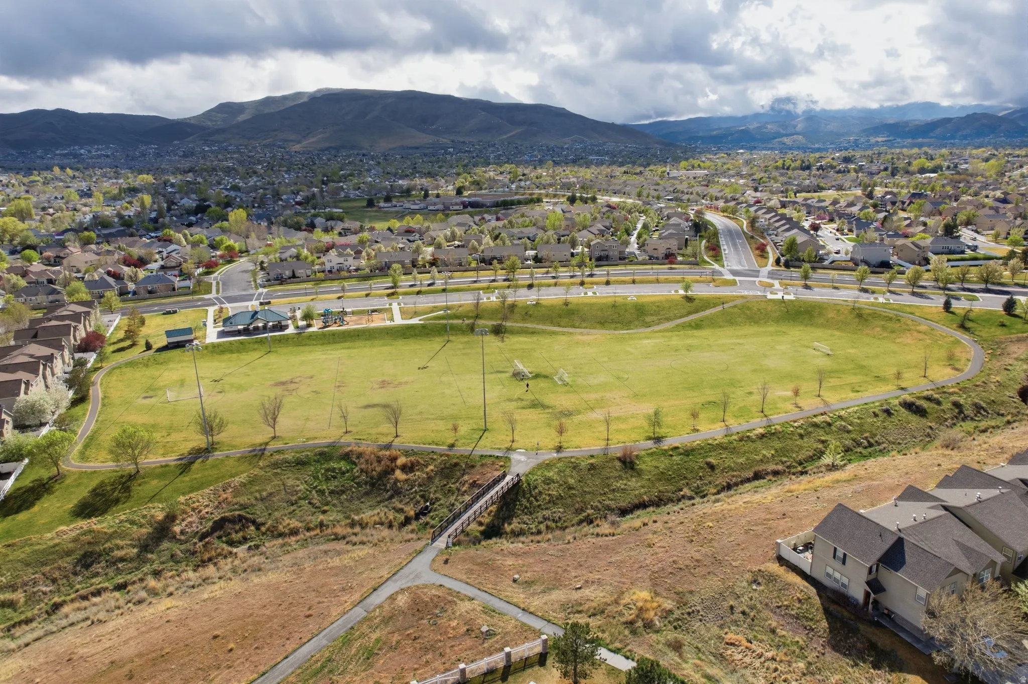 Aerial view of residential area featuring mountains