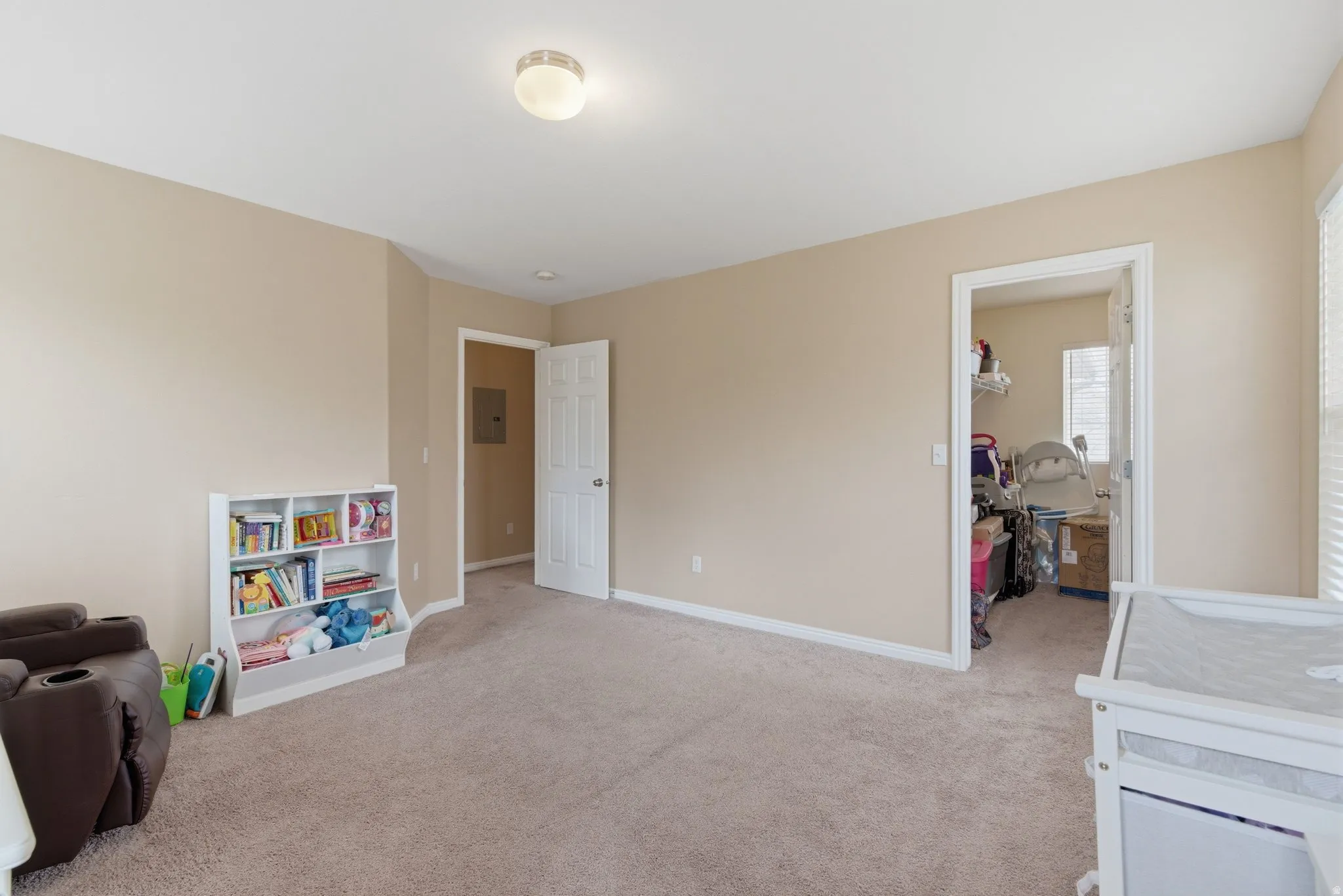 Game room featuring light carpet and baseboards