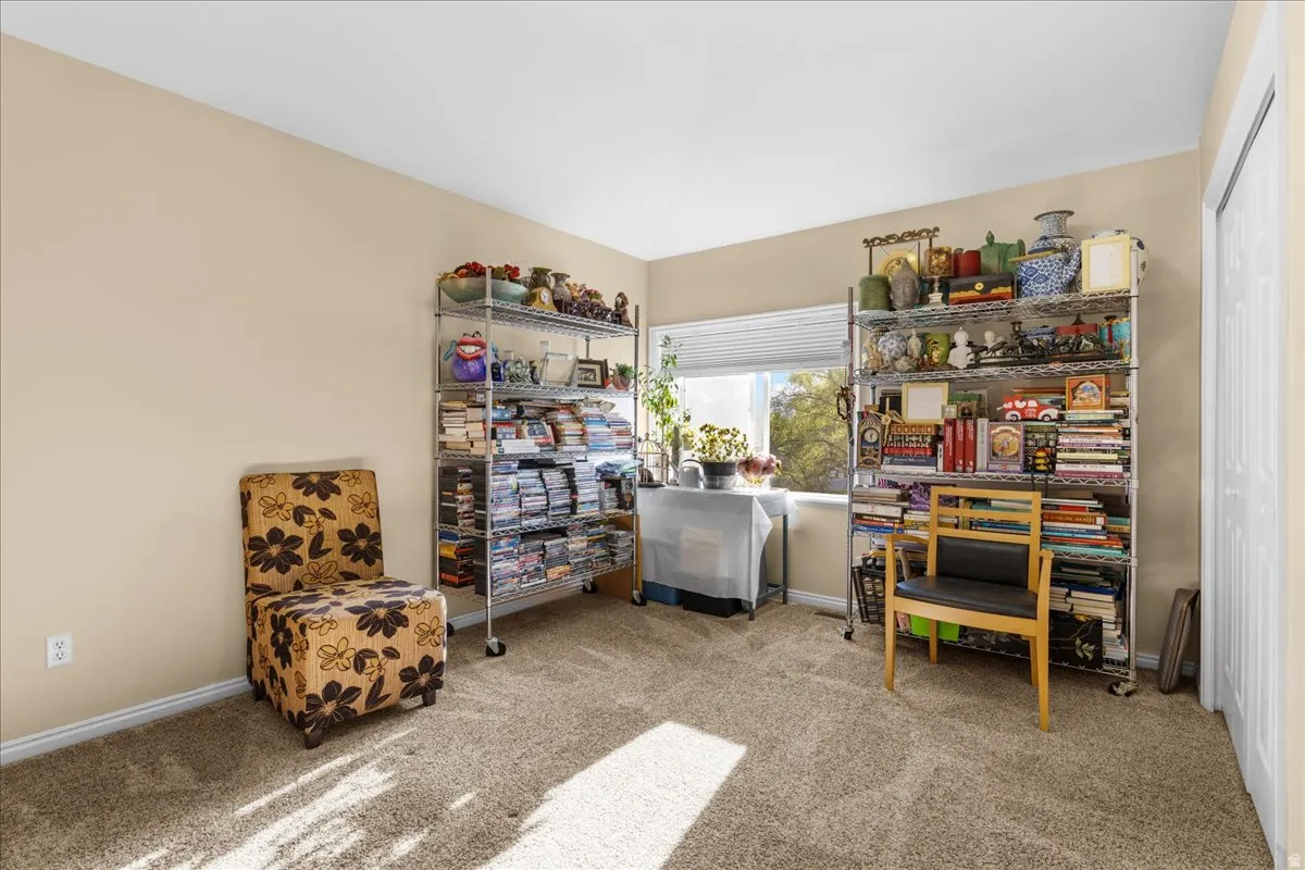 Office space with light carpet and baseboards
