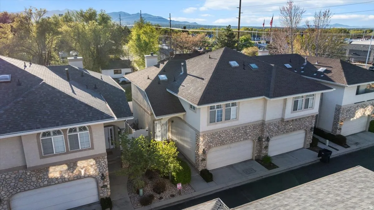 Aerial perspective of suburban area with a mountainous background
