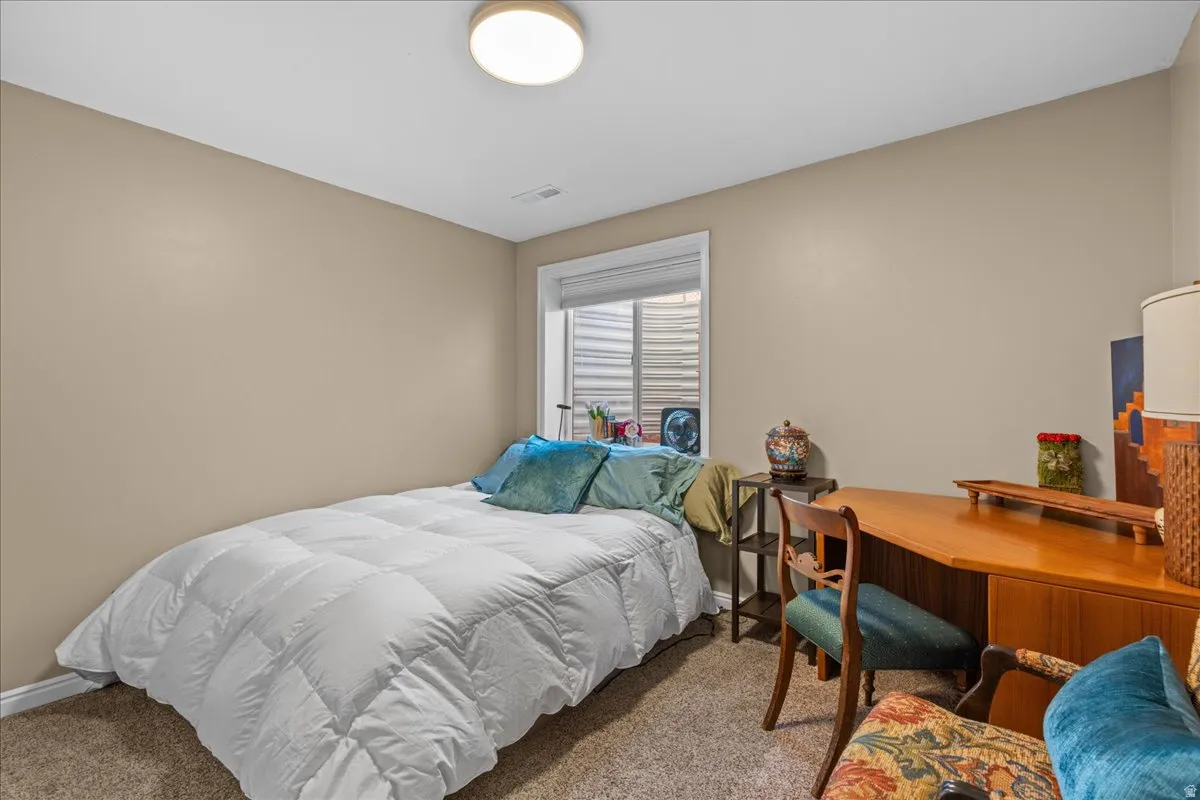 Bedroom featuring carpet floors