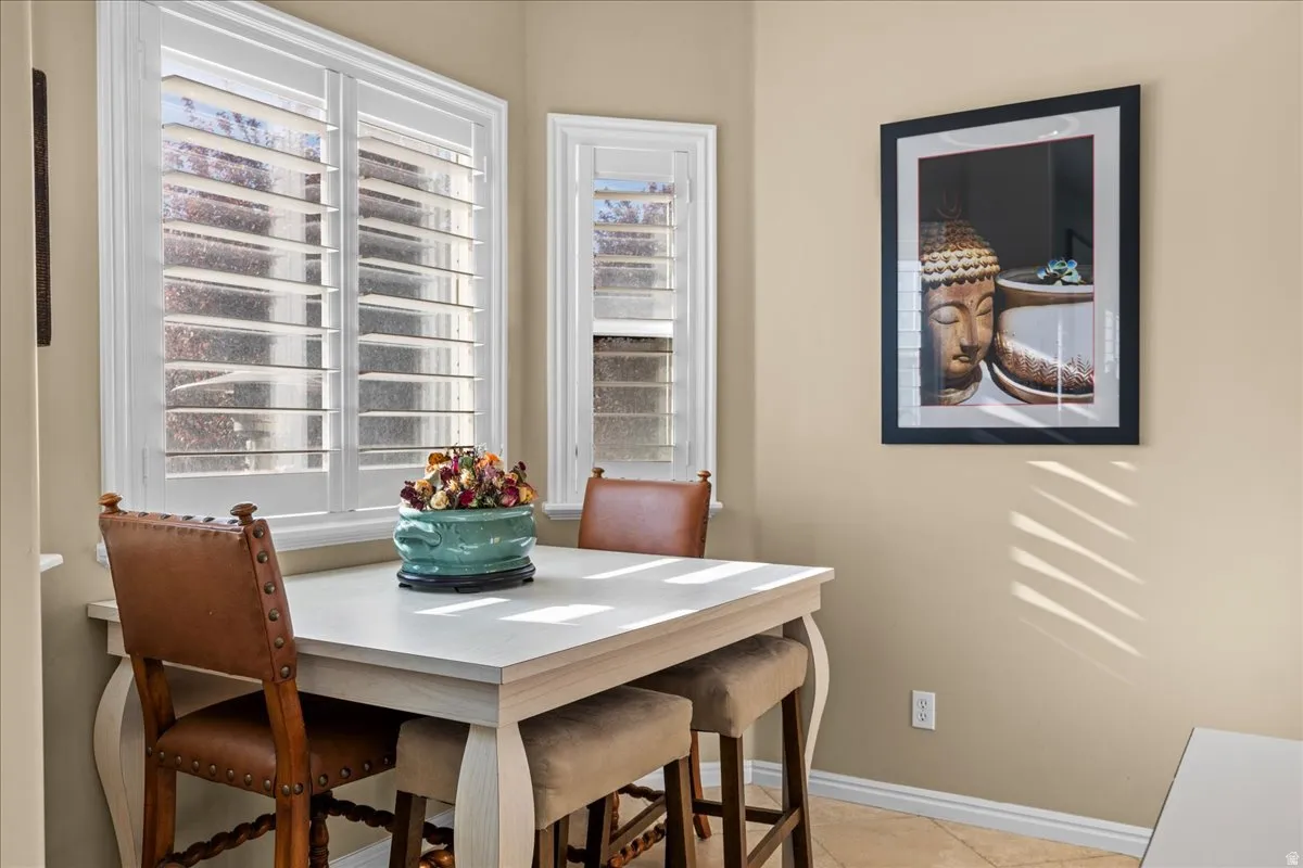 Dining area featuring baseboards and light tile patterned floors