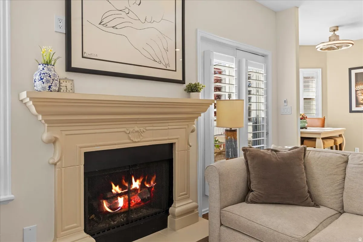 Living area with a warm lit fireplace
