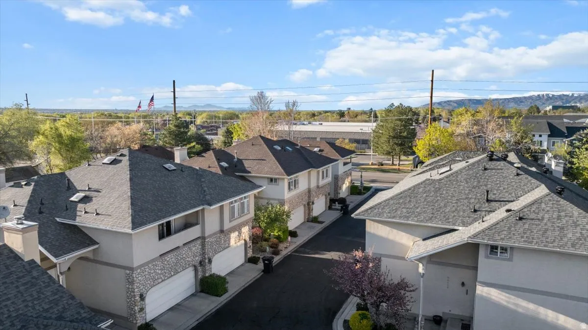 Aerial perspective of suburban area with a mountainous background