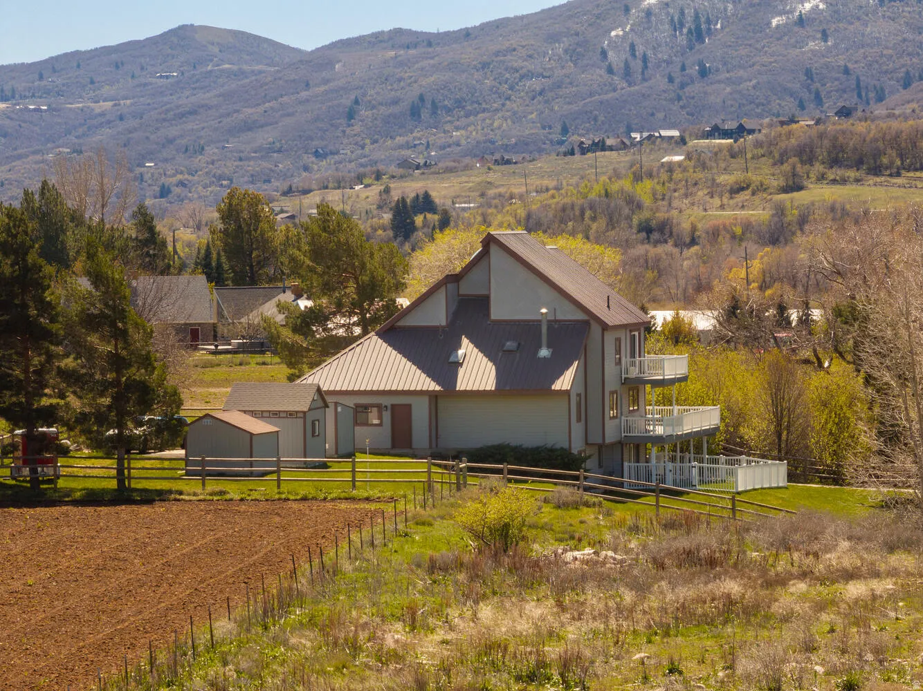 View of front of house featuring a metal roof and a mountain view