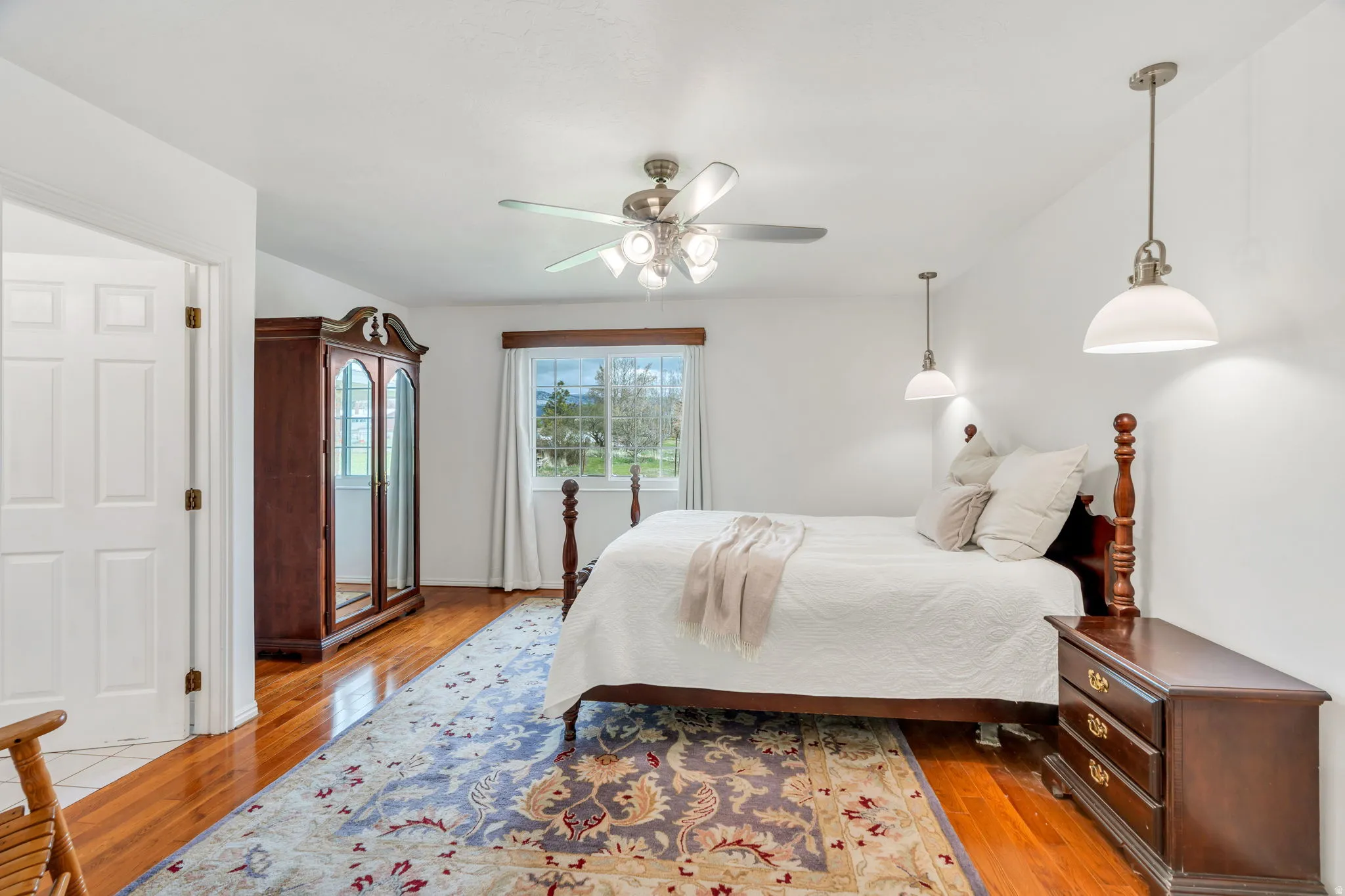 Bedroom featuring light wood finished floors and a ceiling fan