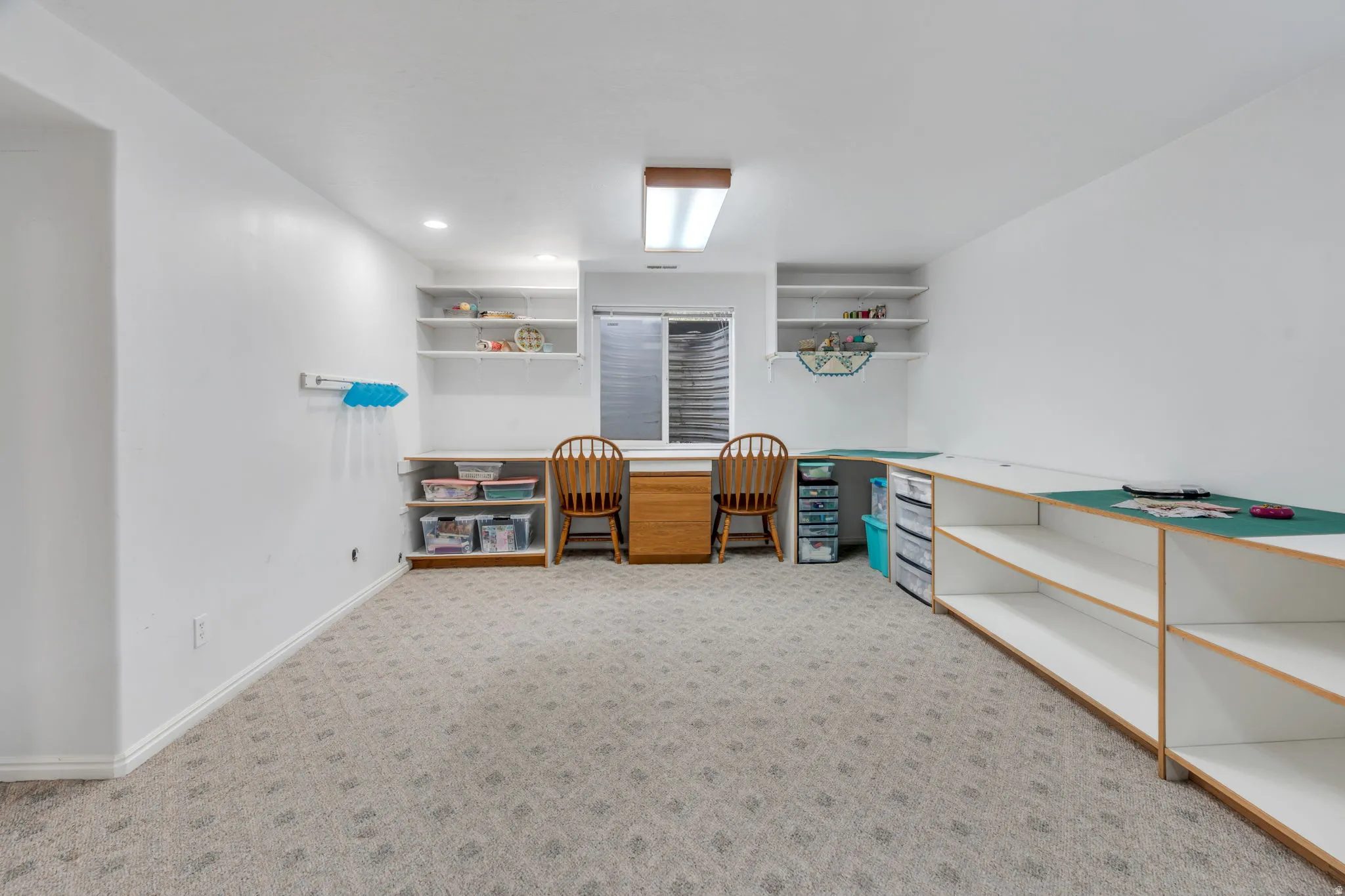 Office featuring light colored carpet and recessed lighting