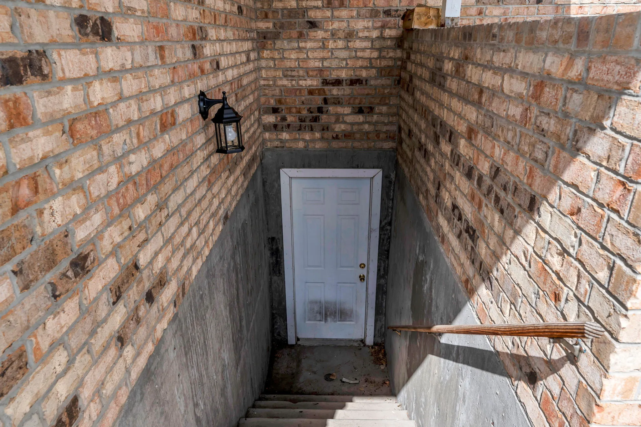 View of exterior entry with brick siding