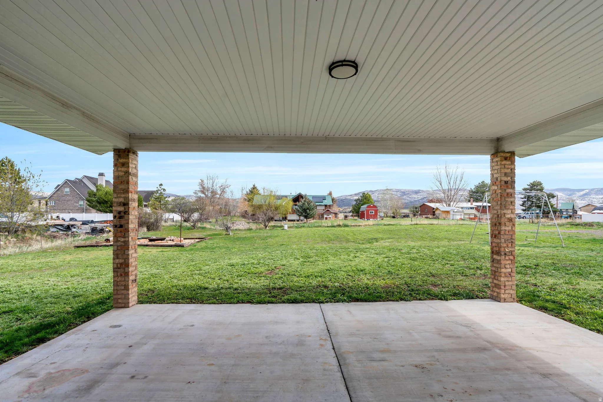 View of patio / terrace featuring a mountain view and a residential view