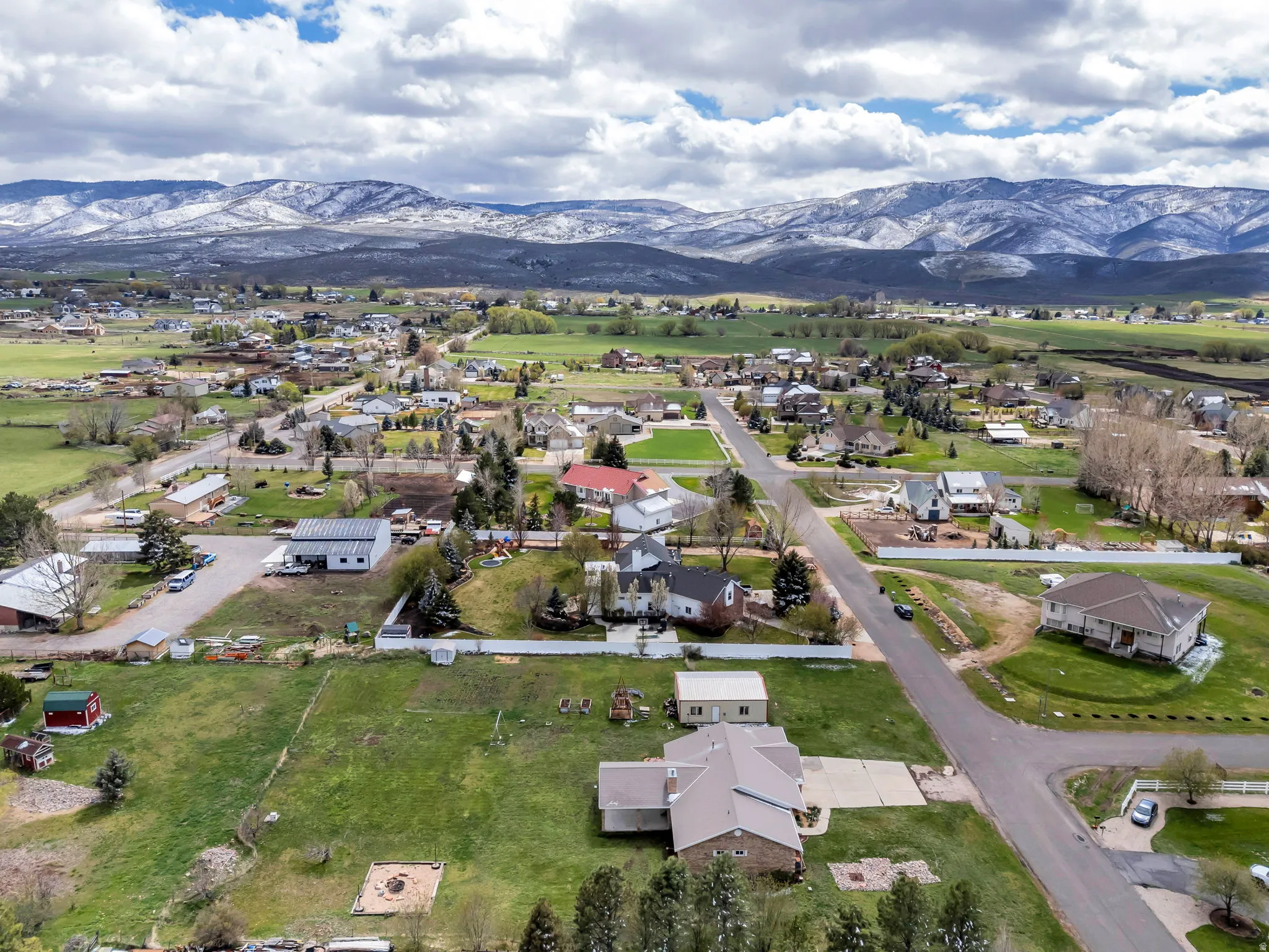 View of property location featuring a mountain backdrop and nearby suburban area