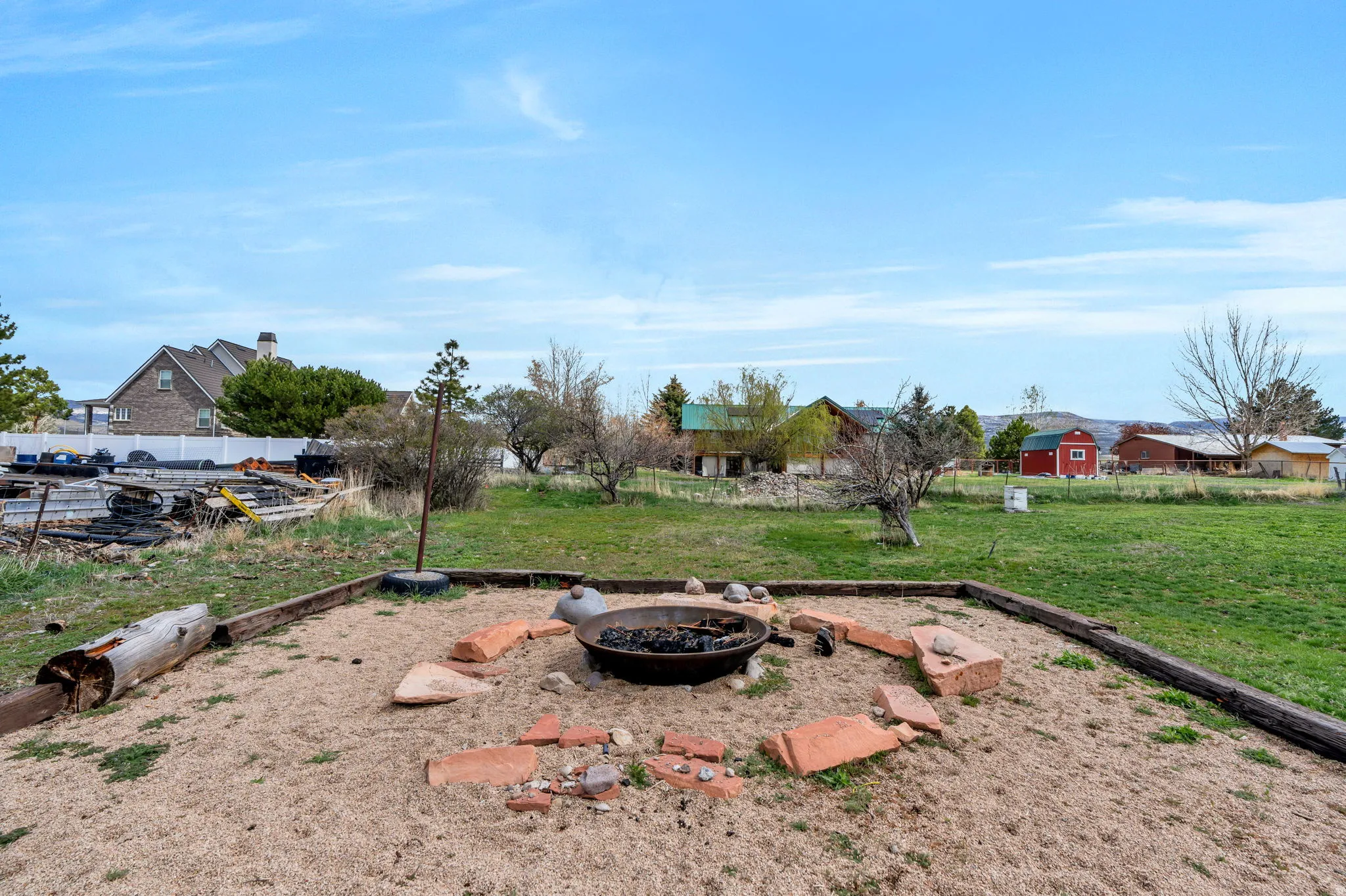 View of yard featuring an outdoor fire pit