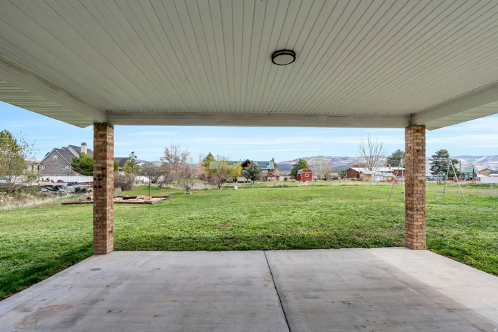 View of patio / terrace featuring a mountain view and a residential view