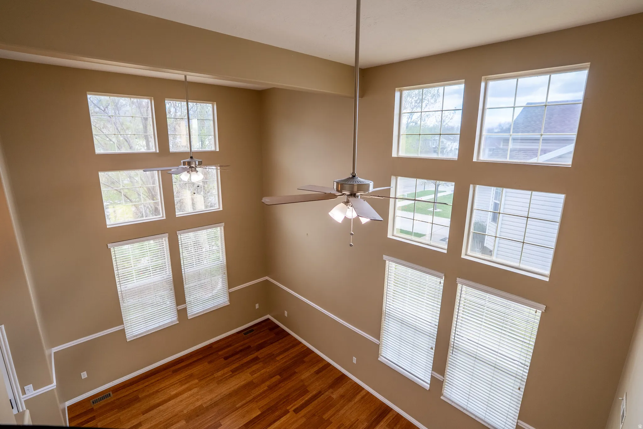 Interior space featuring wood finished floors and a ceiling fan
