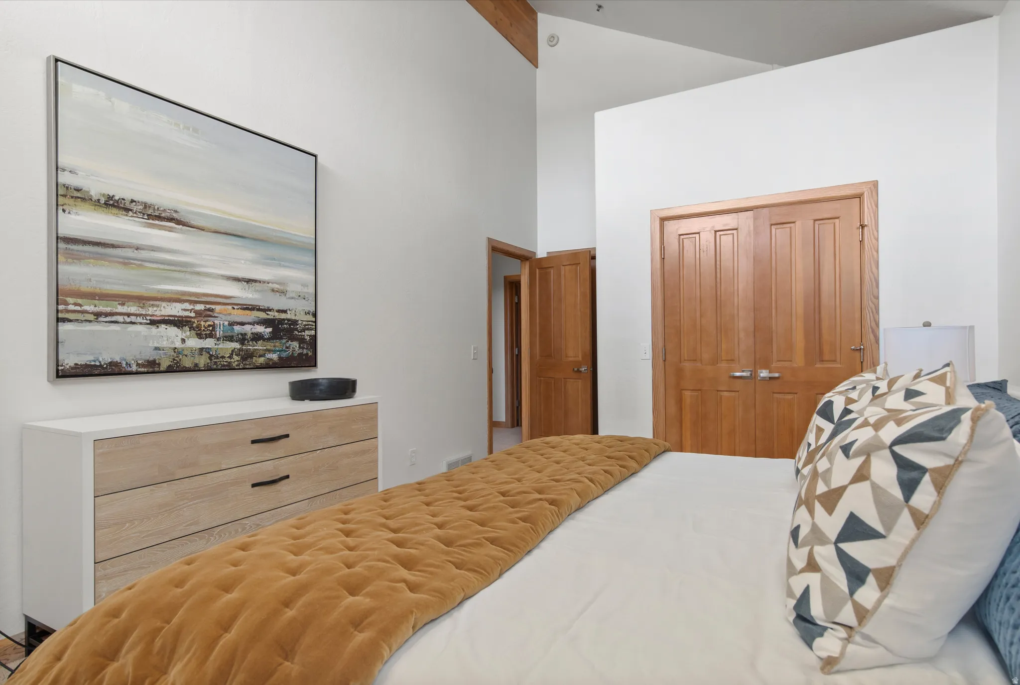 Bedroom featuring a closet and vaulted ceiling
