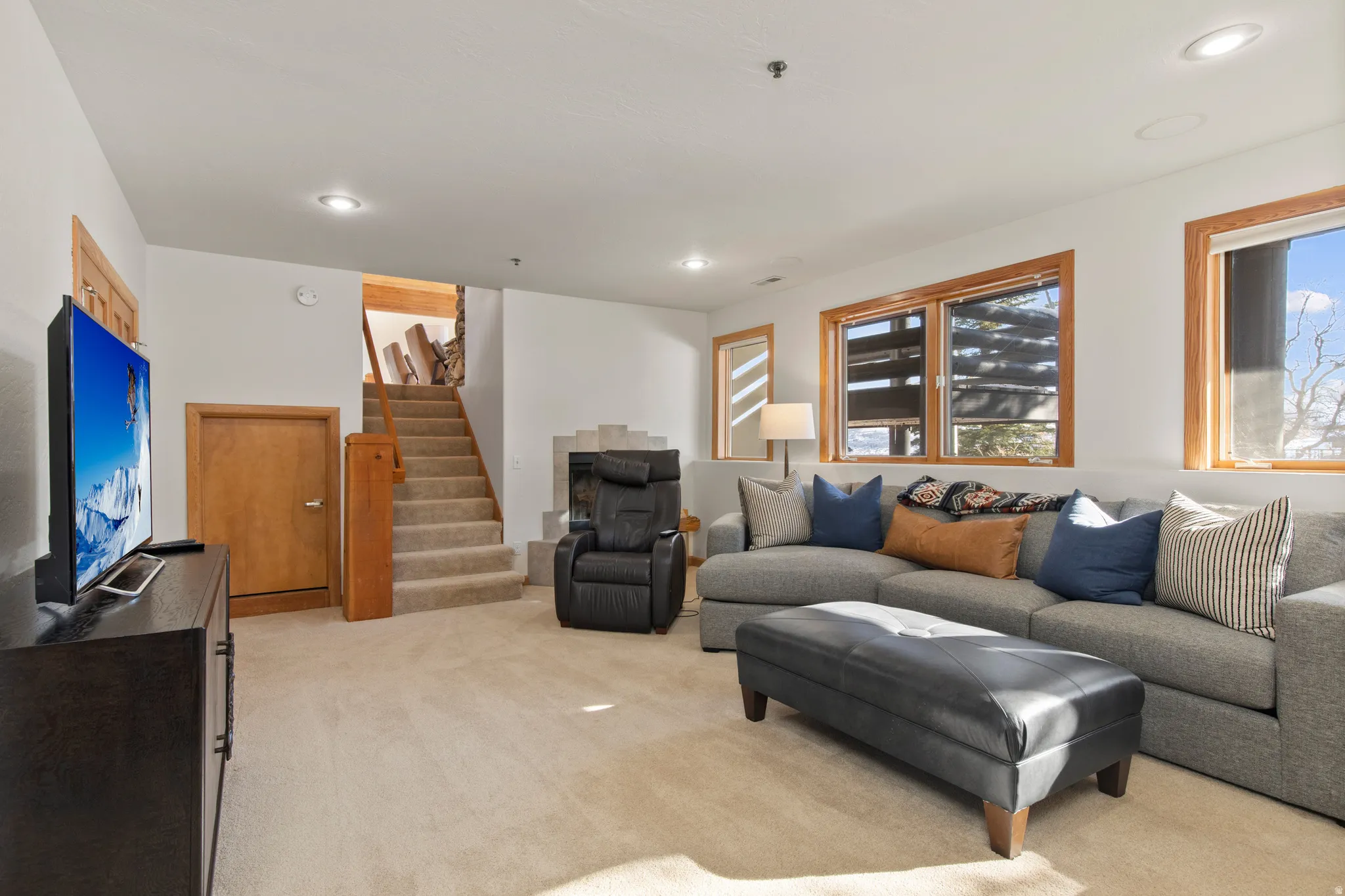 Living room featuring light carpet and recessed lighting