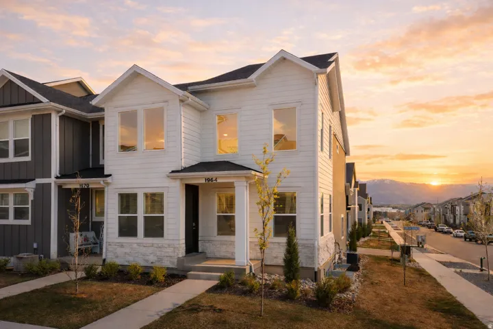 View of front facade featuring stone siding and a residential view