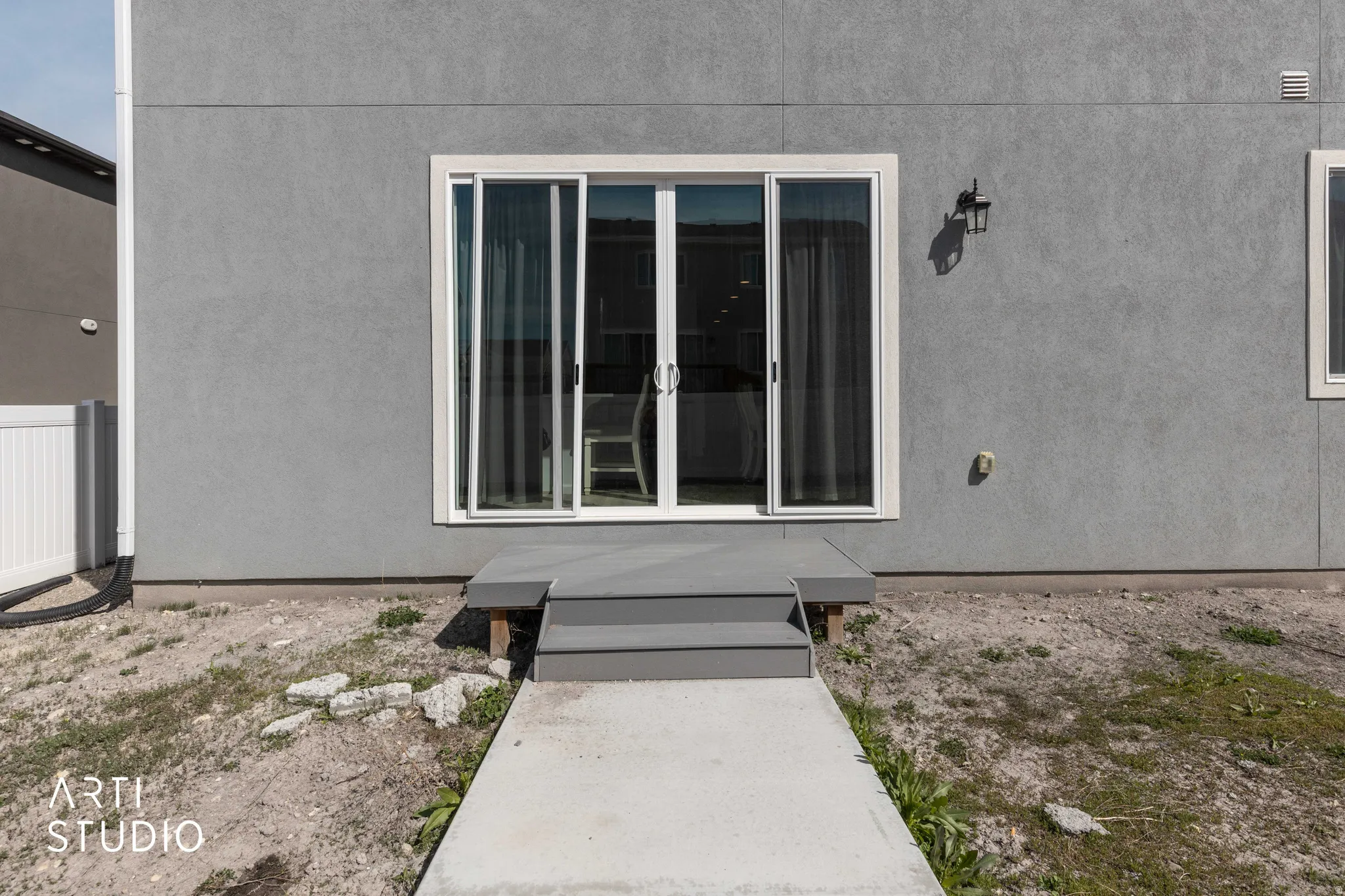 Entrance to property featuring stucco siding
